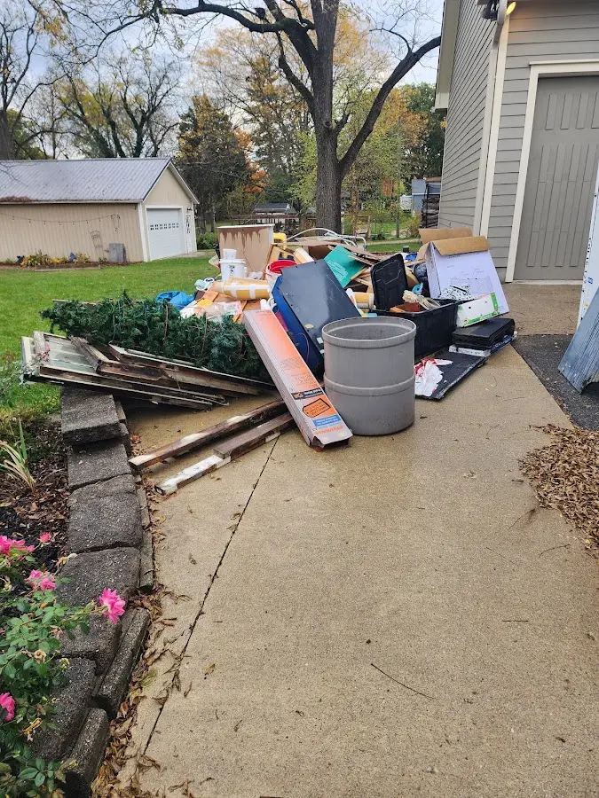Dumpster being loaded with debris for Commercial Dumpster Rental in Andover